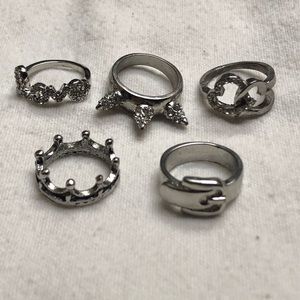 Five silver and sparkley rings